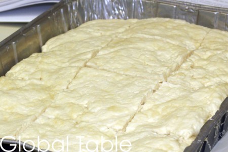 Scoring the dough with a sharp knife results in a prettier bread.