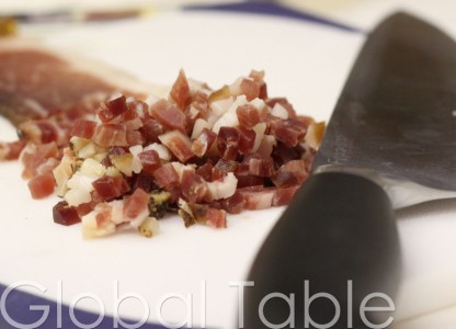 Minced Speck adds a ham flavor to the green beans.