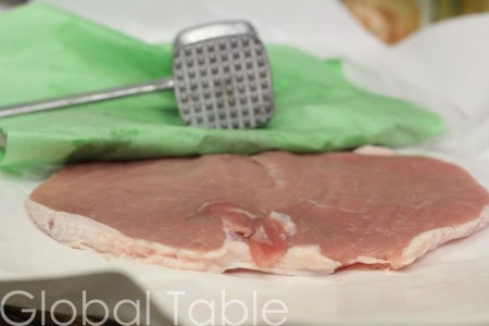 Pork cutlet nearly doubles in width after being flattened with a mallet.