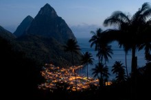 The village of Soufriere lit up as night falls. the Pitons in the background are volcanic plugs rising straight out ogf the sea. Photo by Tri-X Pan.