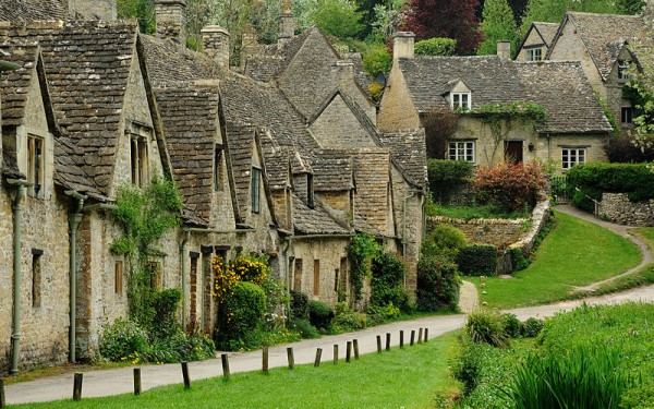 Arlington Row, Bibury, UK was built in 1380 as a monastic wool store. The buildings were converted into weaver cottages in the 17th century. Photo by Saffron Blaze.