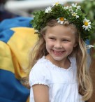Swedish girl wearing a Midsummer crown. Photo by Bengt Nyman.