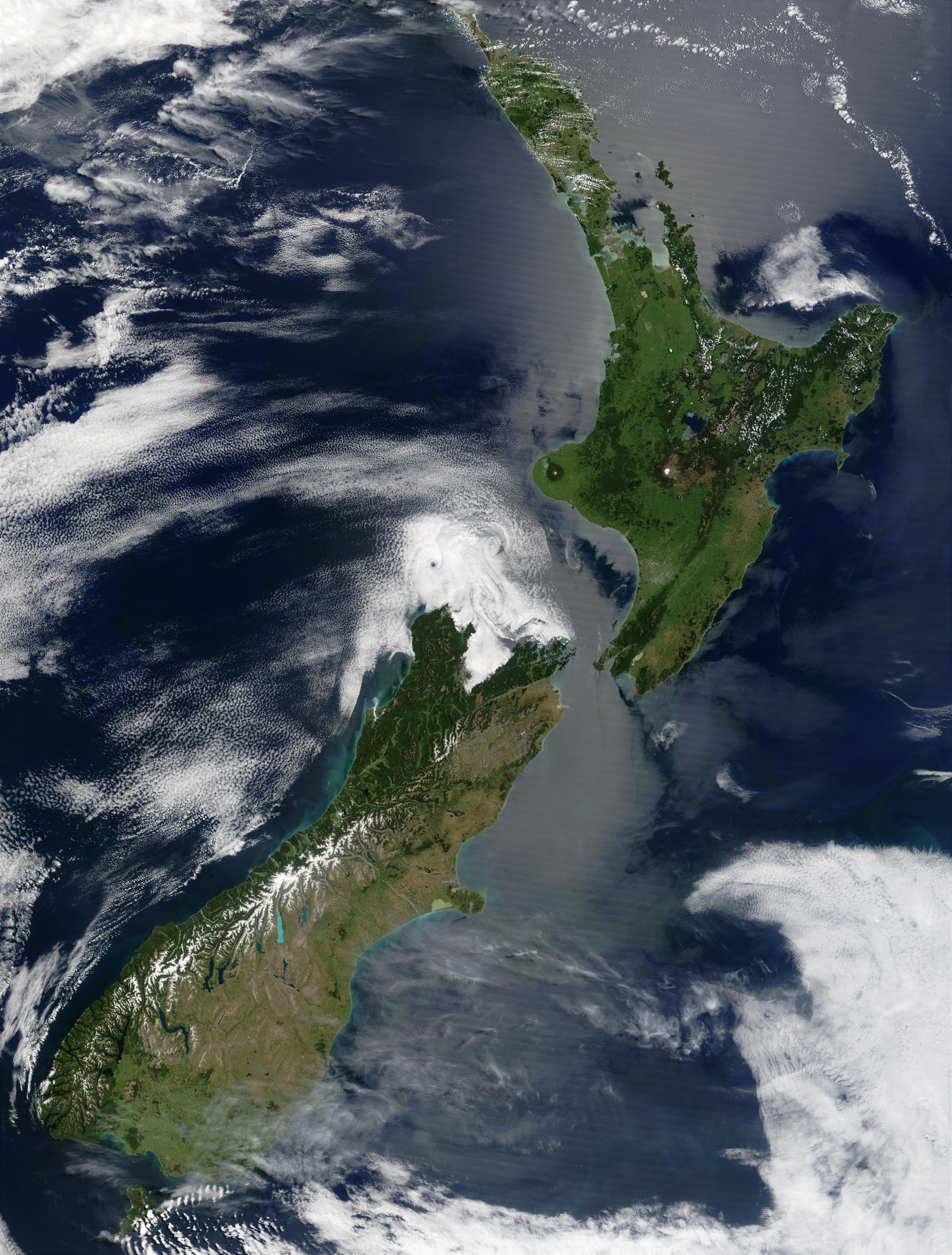 "Satellite image of New Zealand in December 2002" by Unknown - Taken from NASA's Visible Earth: [1]. Licensed under Public Domain via Wikimedia Commons - https://commons.wikimedia.org/wiki/File:Satellite_image_of_New_Zealand_in_December_2002.jpg#/media/File:Satellite_image_of_New_Zealand_in_December_2002.jpg