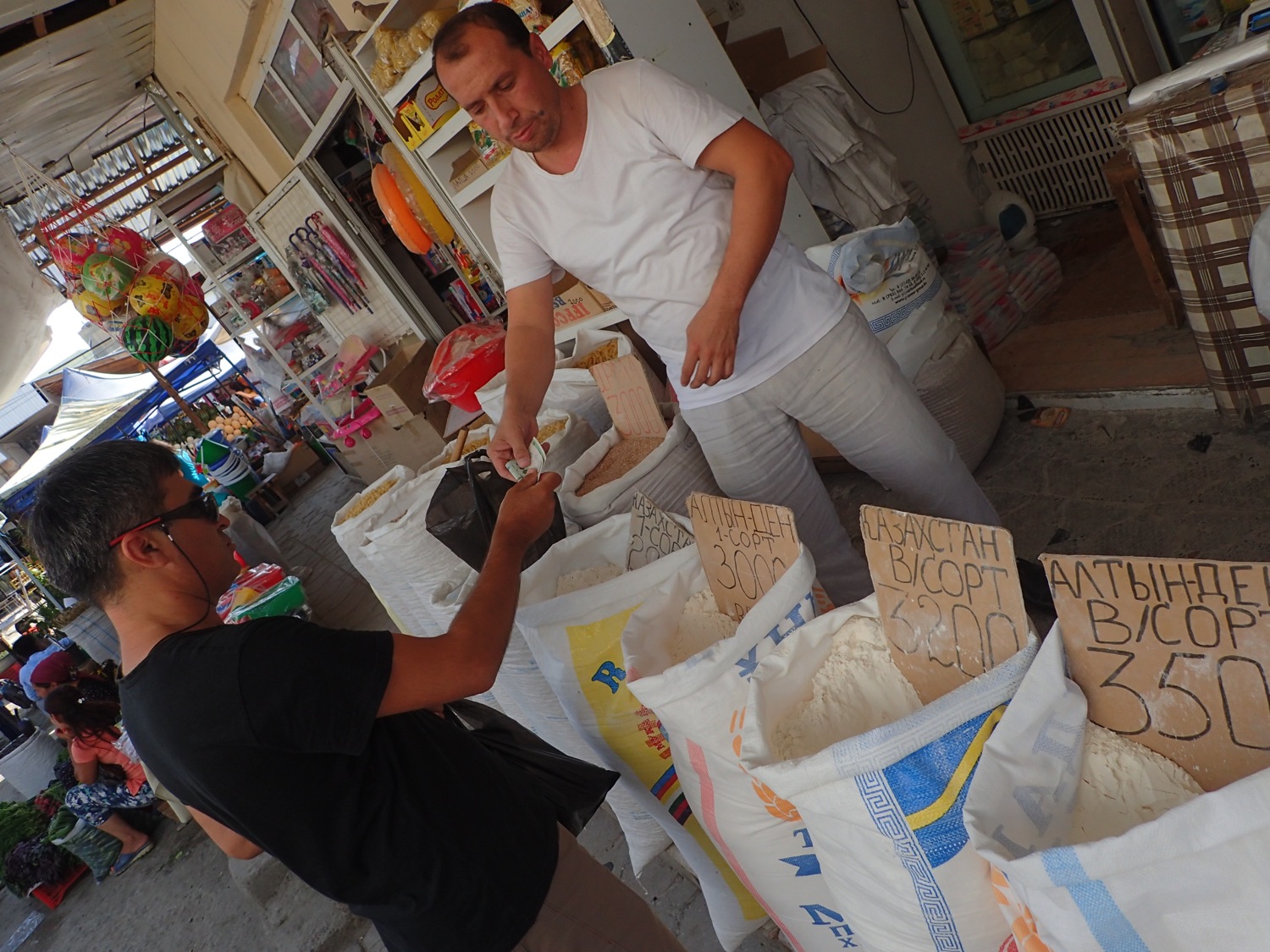 Buying the sugar at a bazaar in Bukhara, Uzbekistan. | Paul Salopek